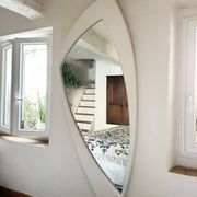 Dismantled Space Age XXL wall mirror in lacquered wood. France, 1970s.