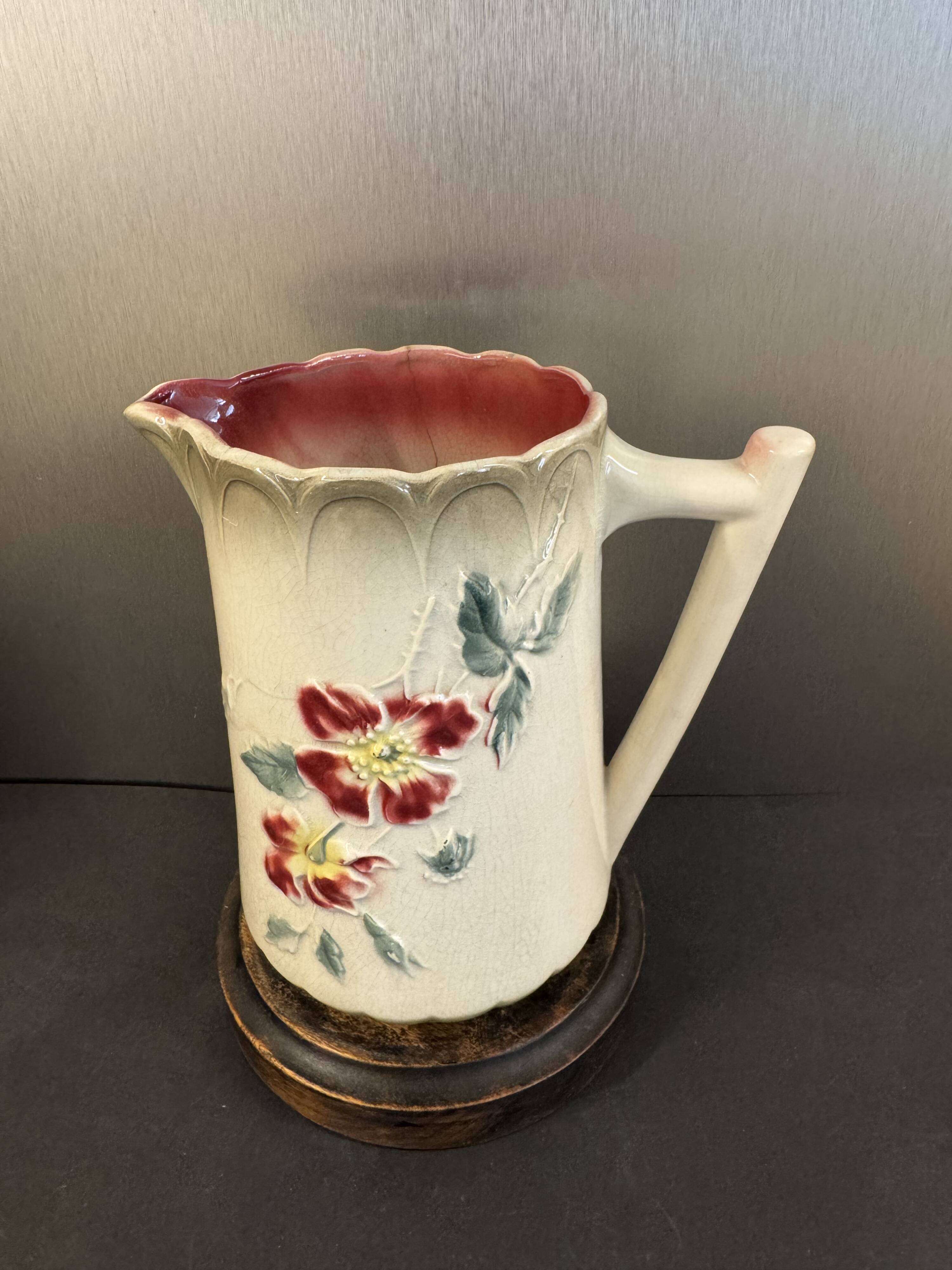 Antique pitcher in slipware with floral decoration – red and cream floral design