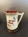 Antique pitcher in slipware with floral decoration – red and cream floral design