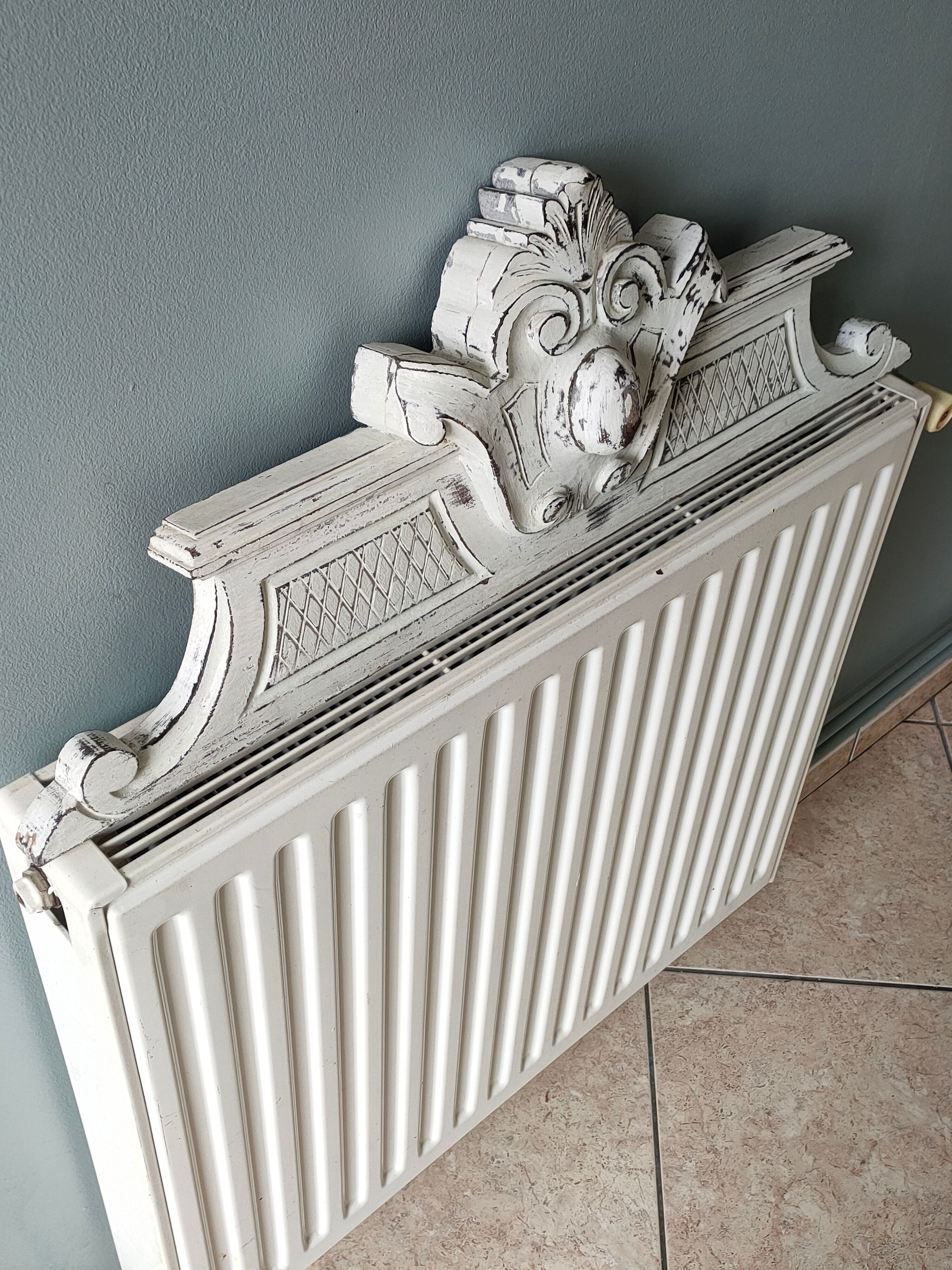 Old pediment in painted wood