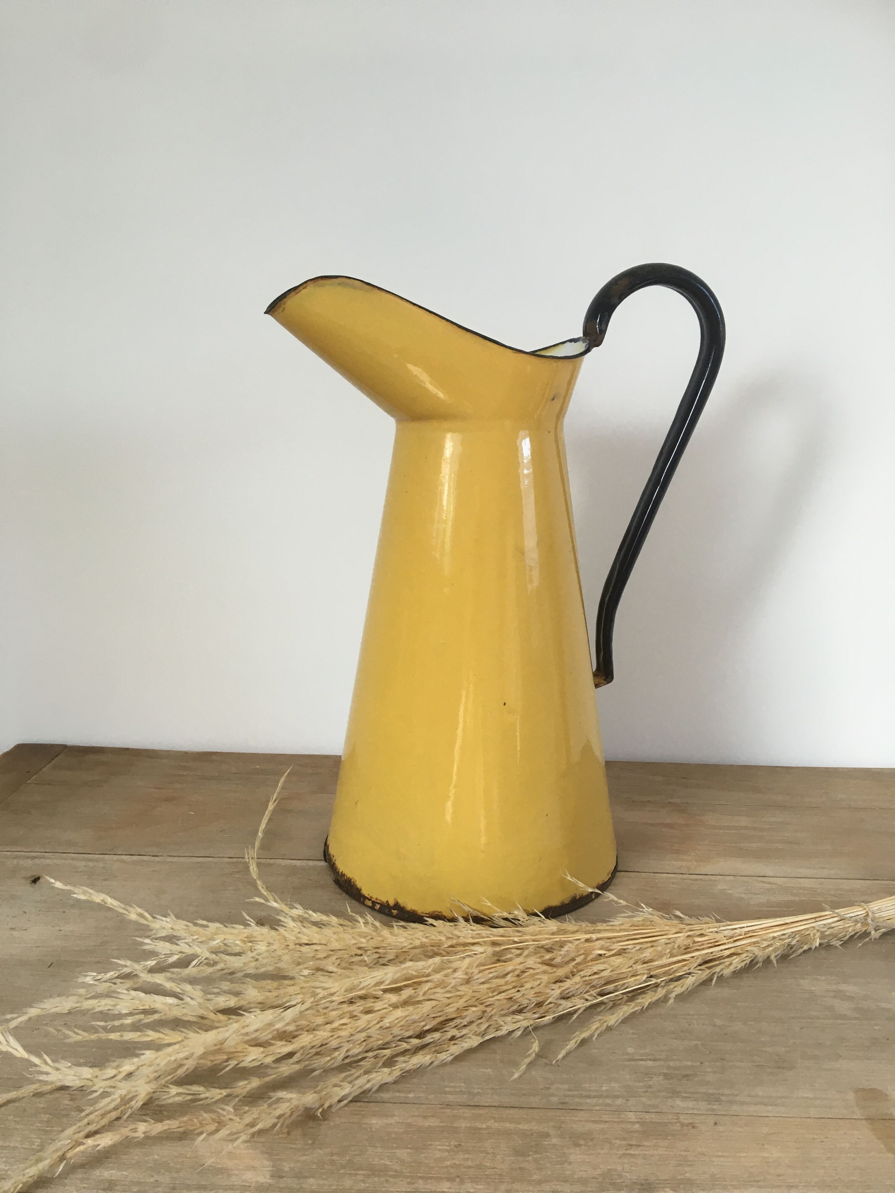 Mustard yellow enamelled sheet metal pitcher