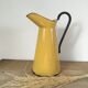 Mustard yellow enamelled sheet metal pitcher