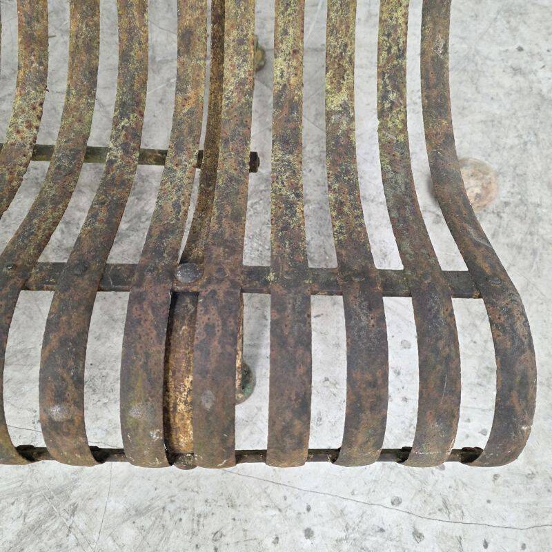 Cast iron garden bench from the late 19th century with slatted backrest.