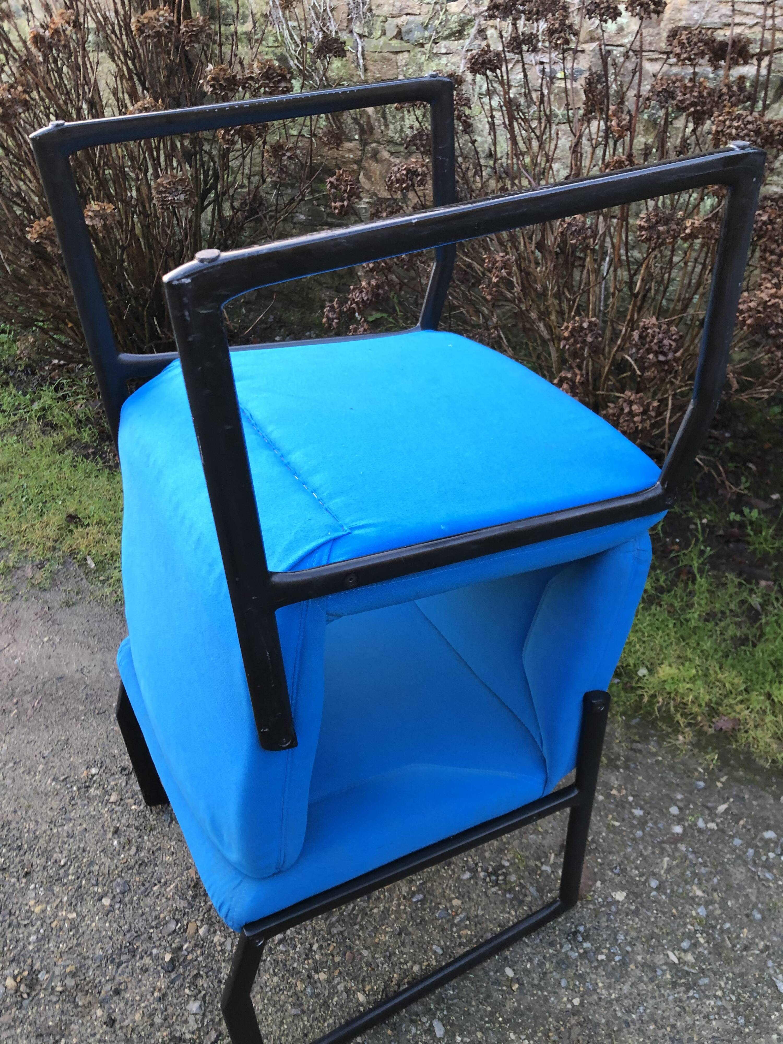 Electric blue fabric designer armchairs with black lacquered metal legs from the 80s.