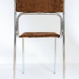 Chrome dining chair upholstered in brown bitten velvet.