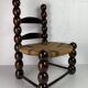 Brutalist wood turned bobbin low rush chair n the style of Charles Dudouyt