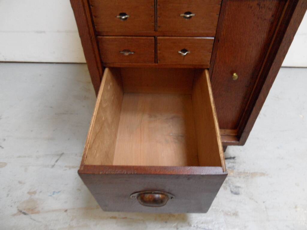 Antique watchmakers cabinet with drawers