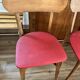 Set of 4 wooden chairs with red vinyl.