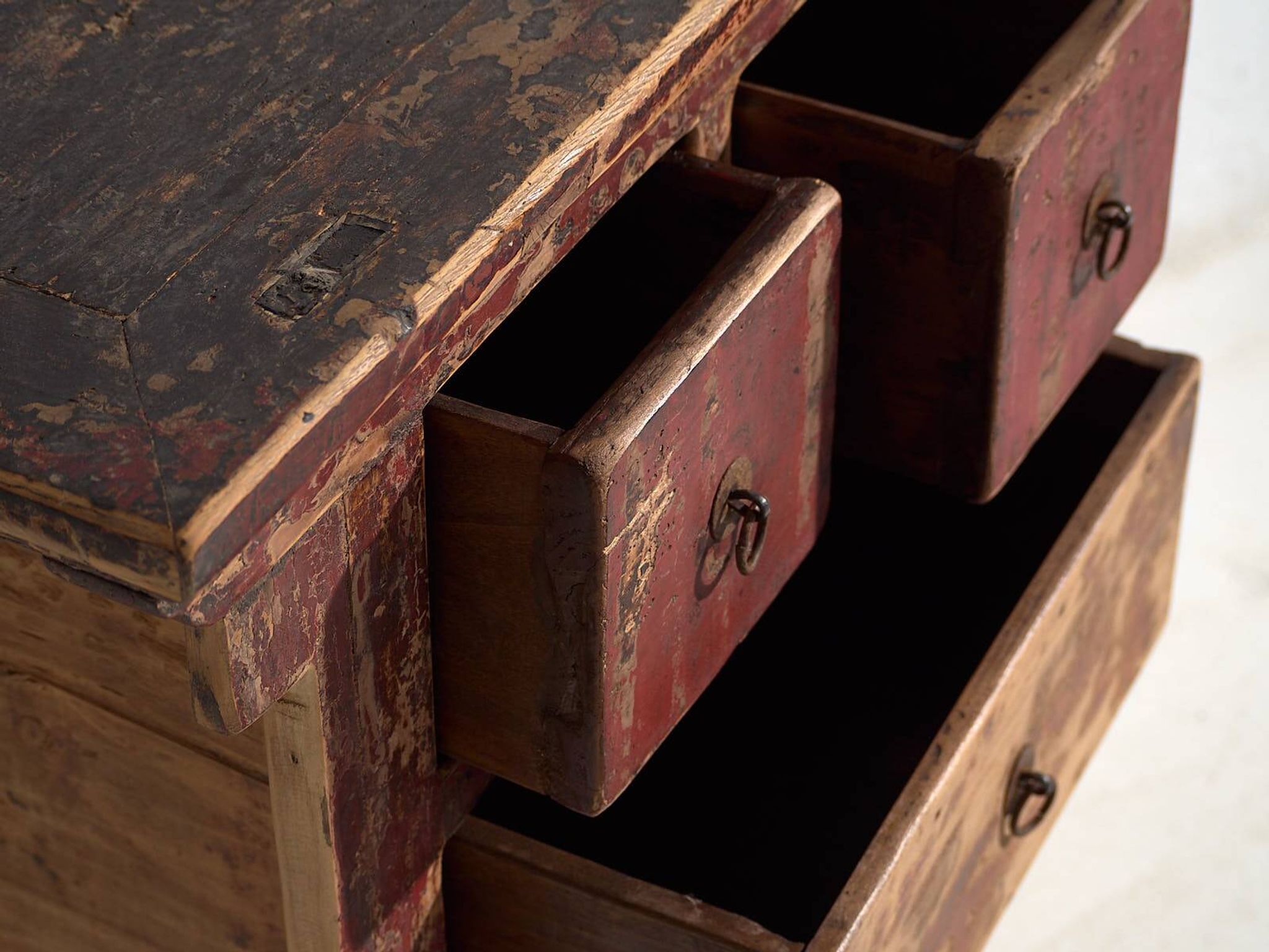Antique oriental chest of drawers with red patina (c.1900)