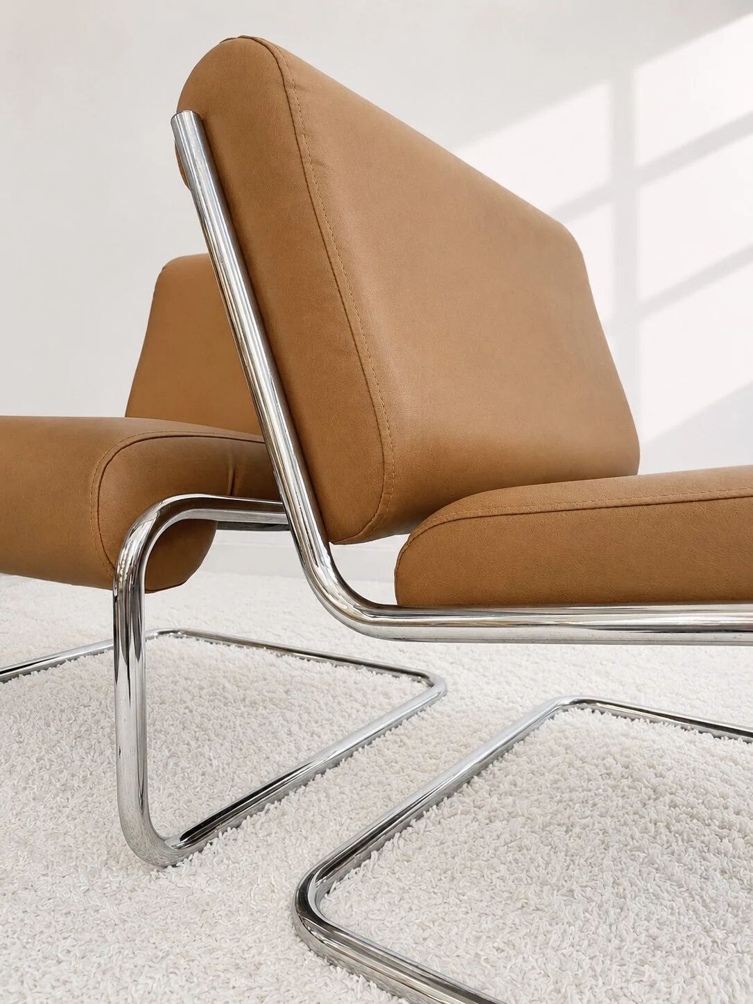 Vintage cantilever armchair. Brown faux leather upholstery. 60s