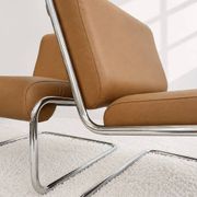 Vintage cantilever armchair. Brown faux leather upholstery. 60s