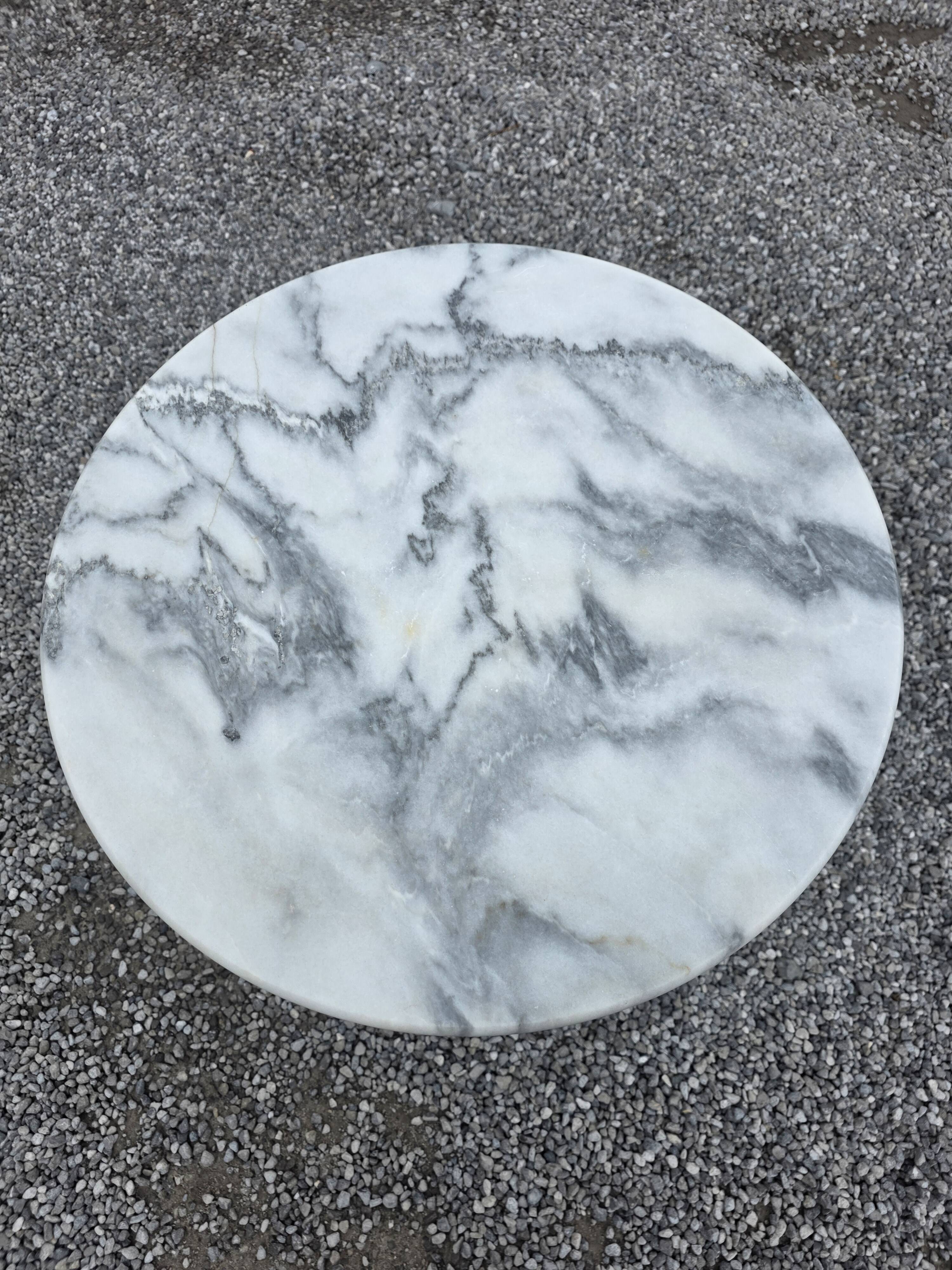 Bistro table with a cast iron base and marble top