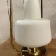 Table lamp in gold metal and opaline.