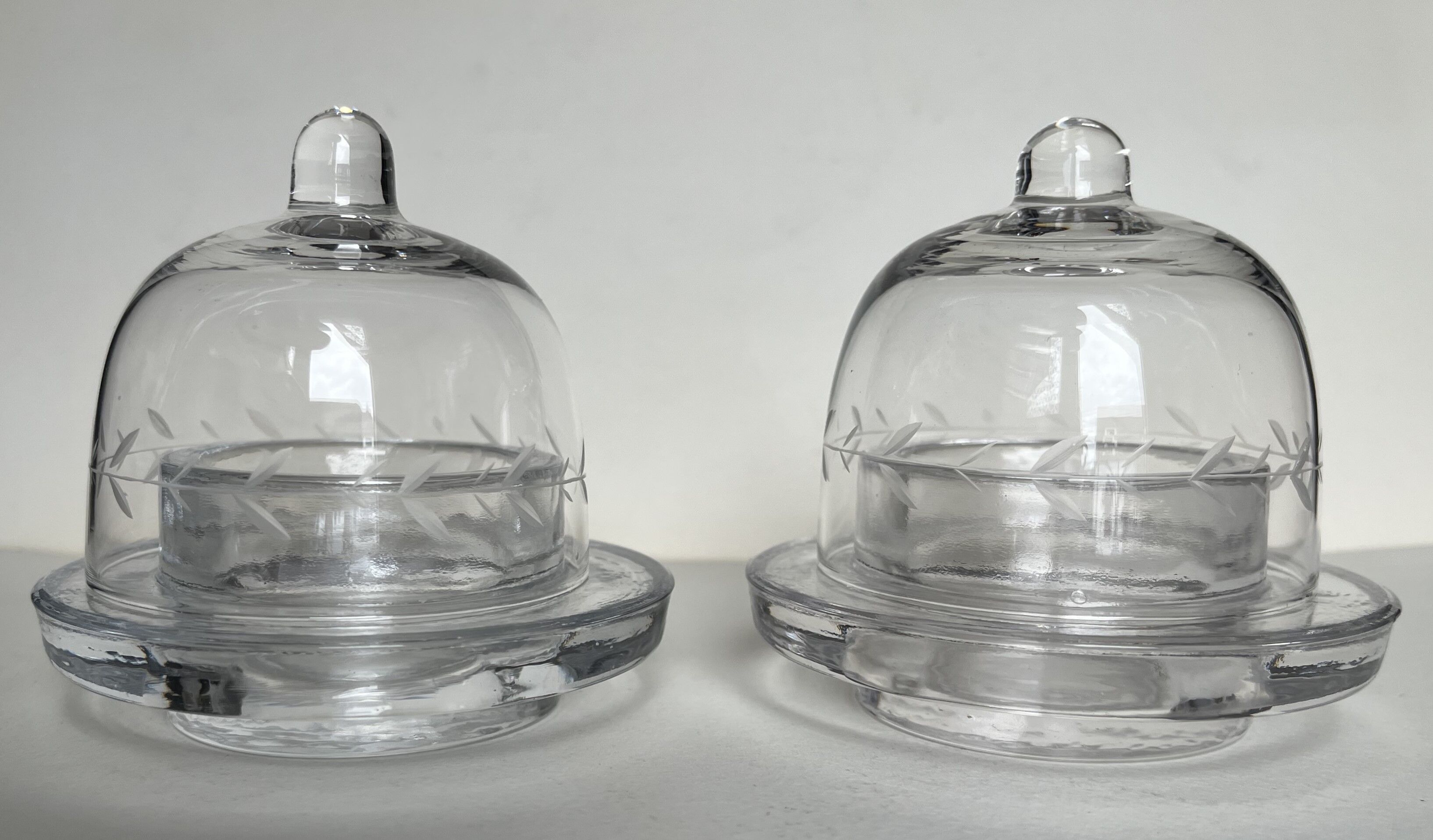 Pair of engraved glass butter dishes