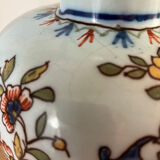 Old vase with floral motif inspired by desvres earthenware