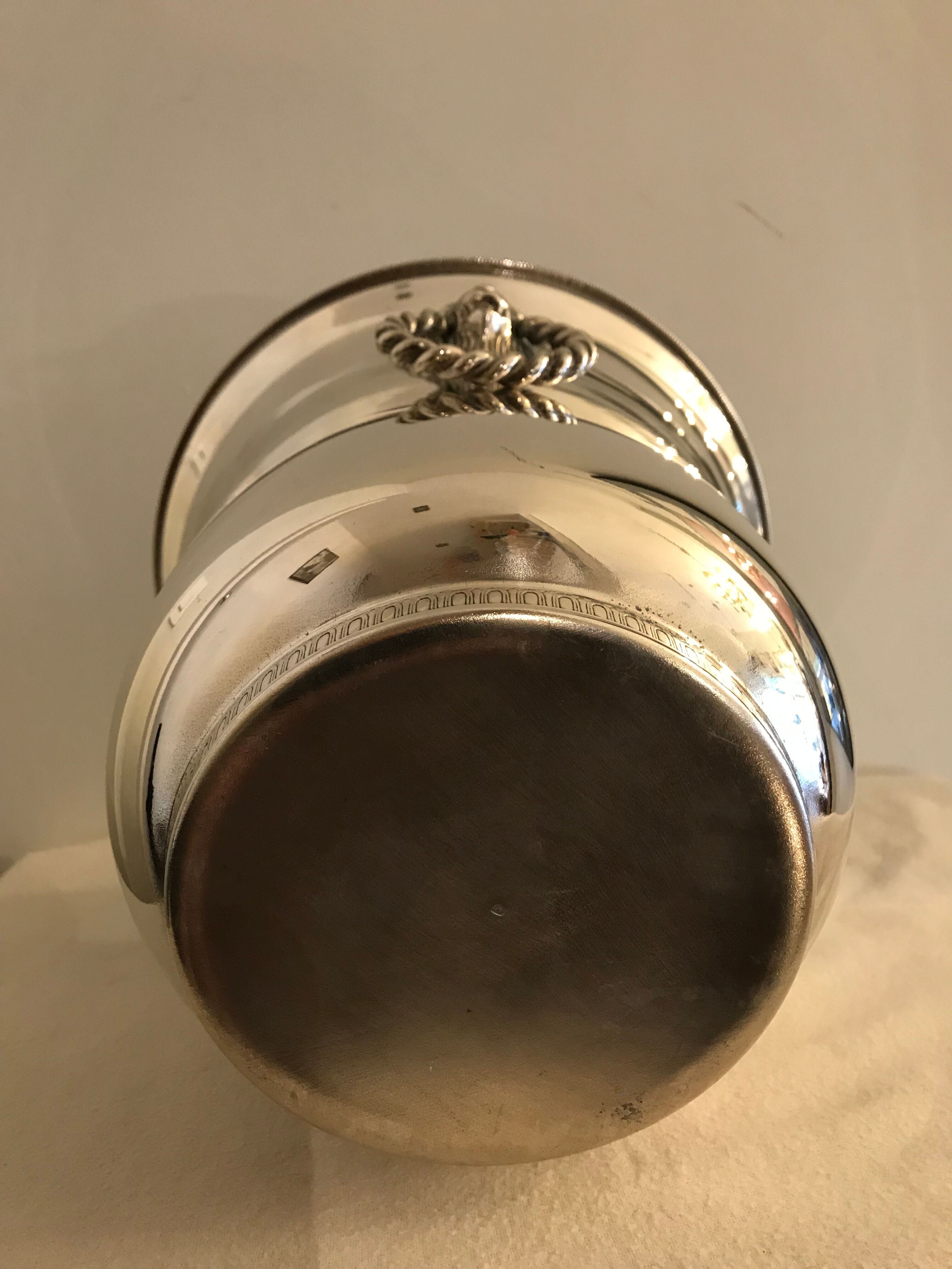 Ancient champagne bucket in silver metal with lion heads