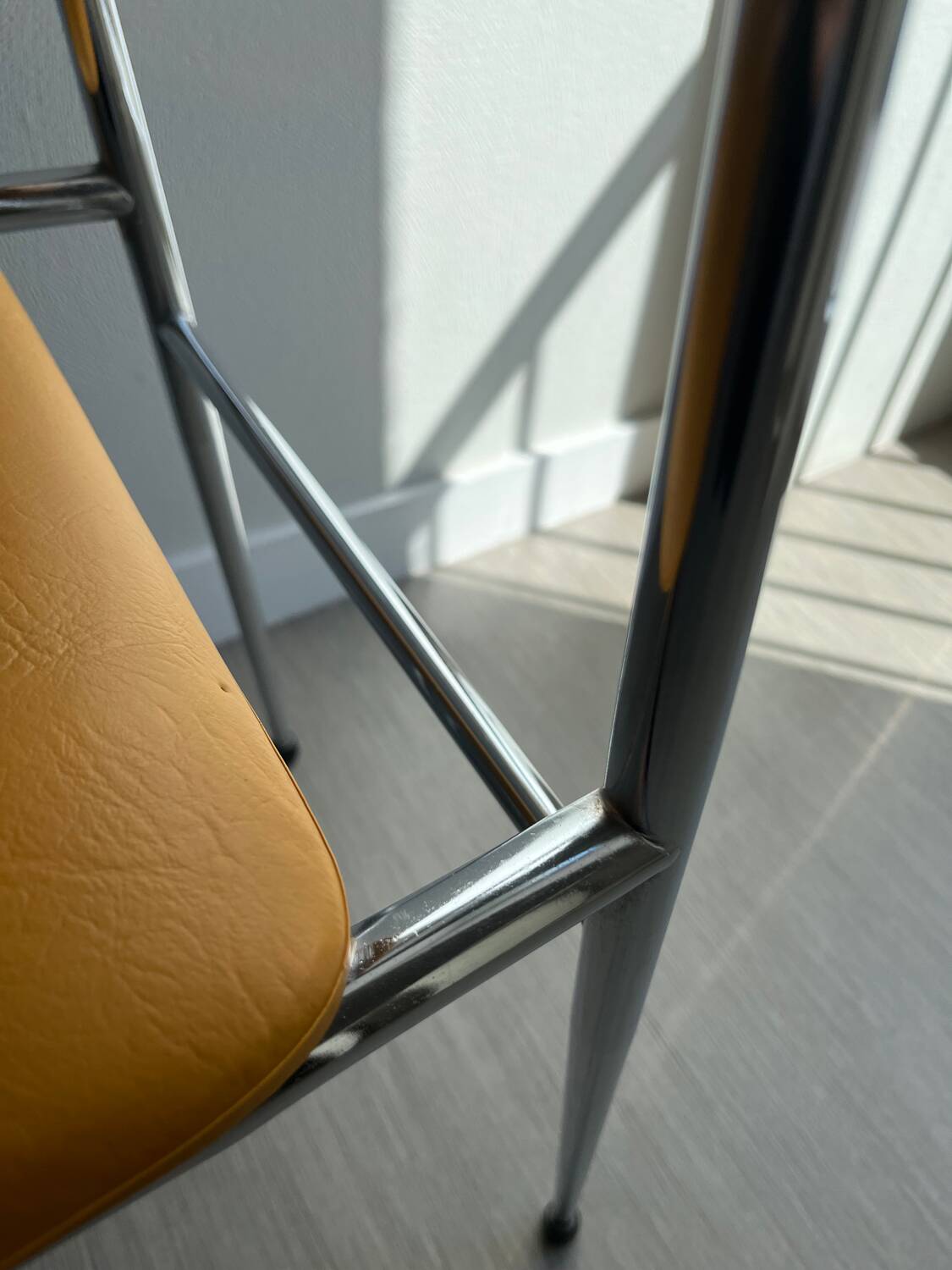 LM vintage chrome and orange/mustard yellow faux leather chairs