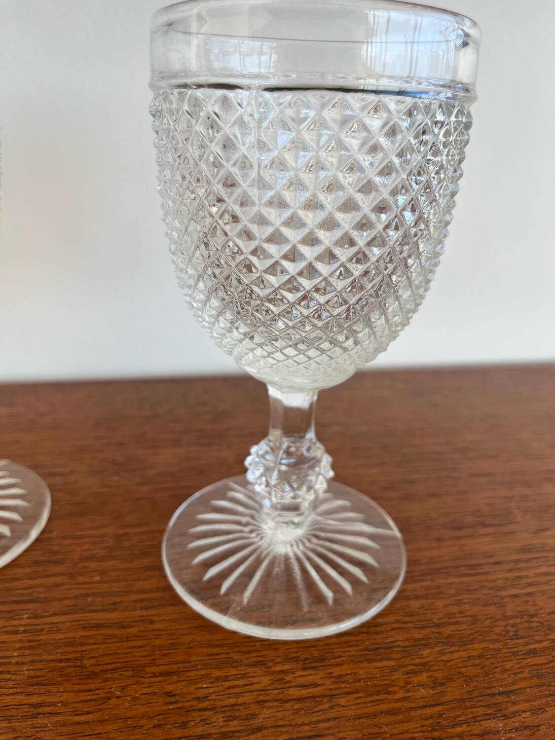 Two 19th-century moulded crystal glasses with diamond points.