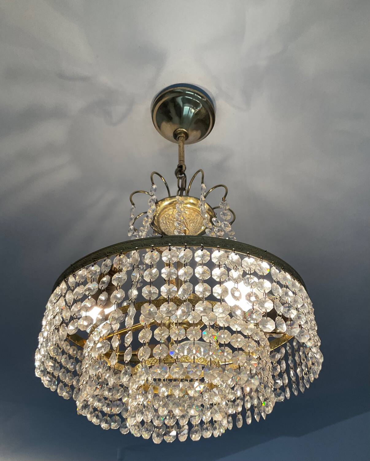 Cascade chandelier with crystal and brass tassels