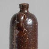 Enamelled brown sandstone bottle with handle
