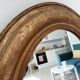 Louis Philippe 19th century oval gilded mirror in wood and stucco