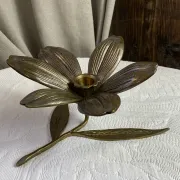 Flower candlestick and removable ashtrays in solid brass.