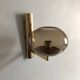 Smoked glass and gold metal wall light, design by Gaetano Sciolari.