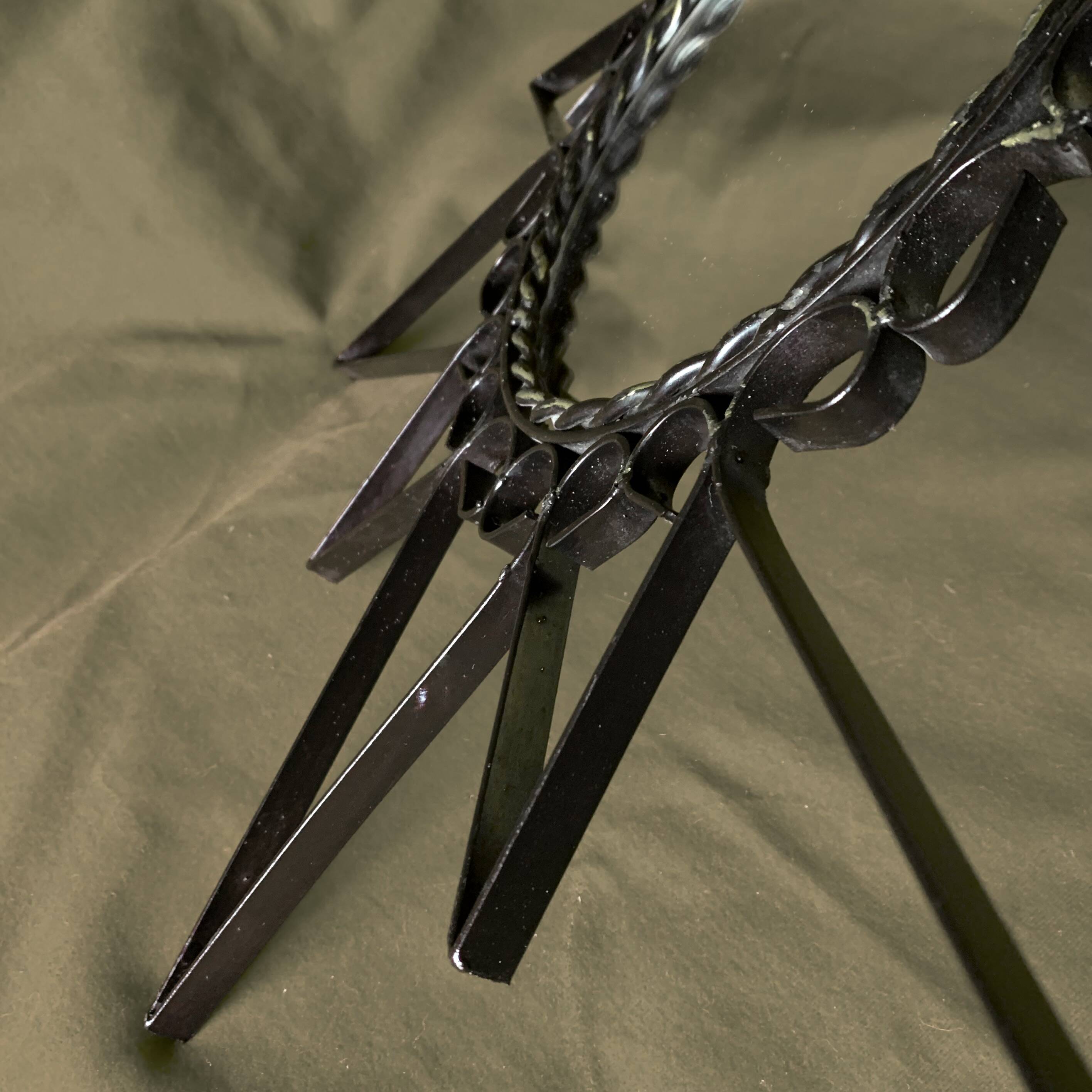 Old wrought metal sun mirror