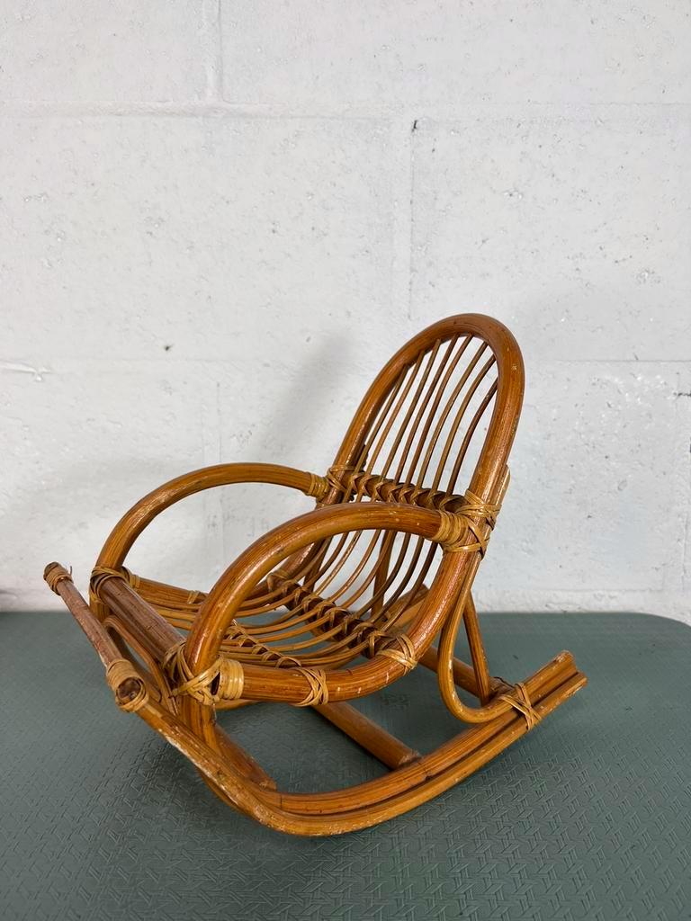 Vintage doll rocking chair in rattan