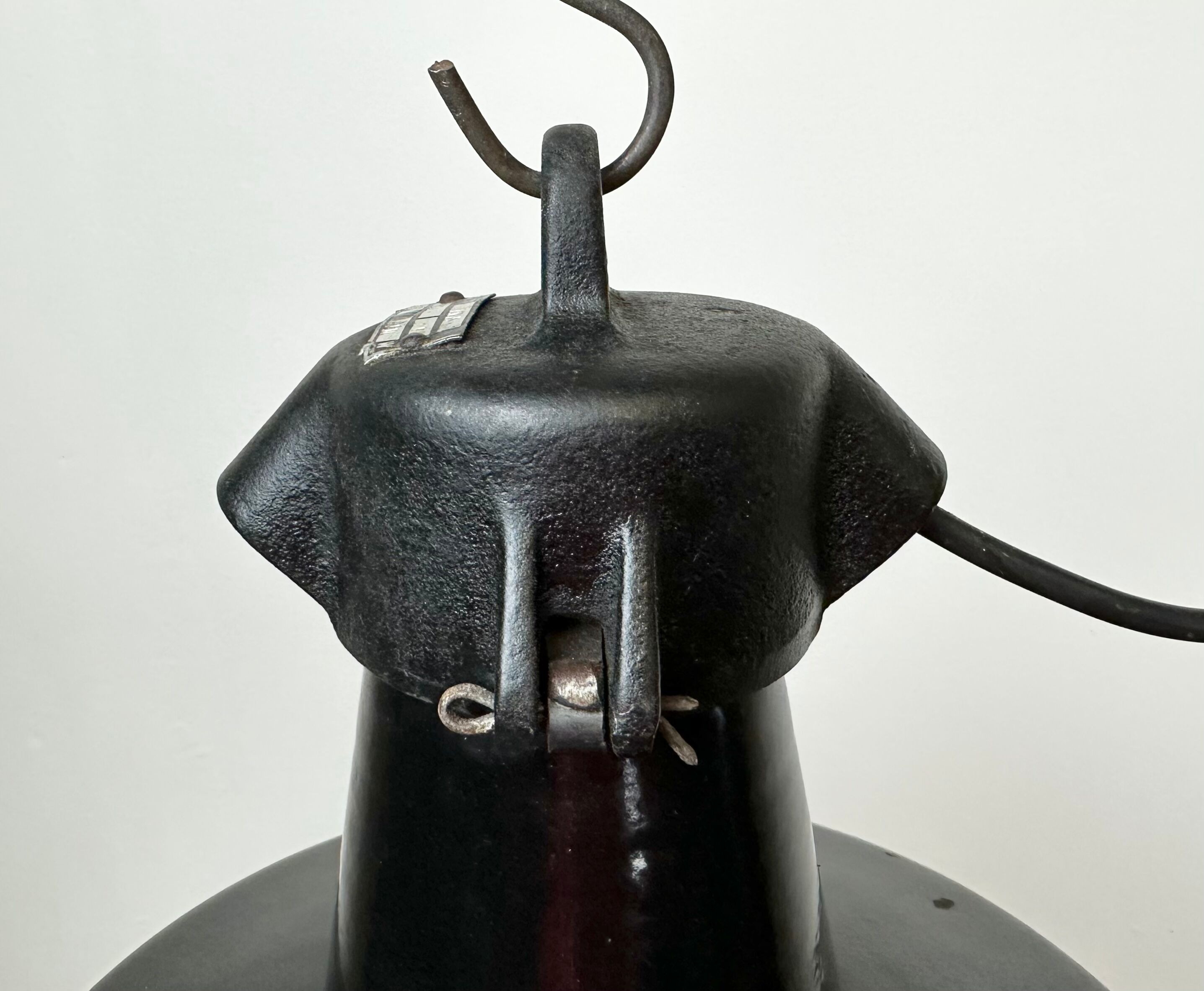 Industrial black enamel factory lamp with cast iron top, 1960s