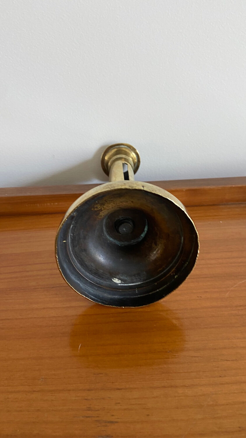Old brass push candle holder