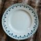 13 mismatched flat plates in ironstone