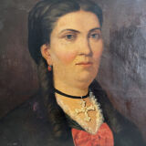 Old oil painting on canvas portrait of a woman with a red bow, late 19th century