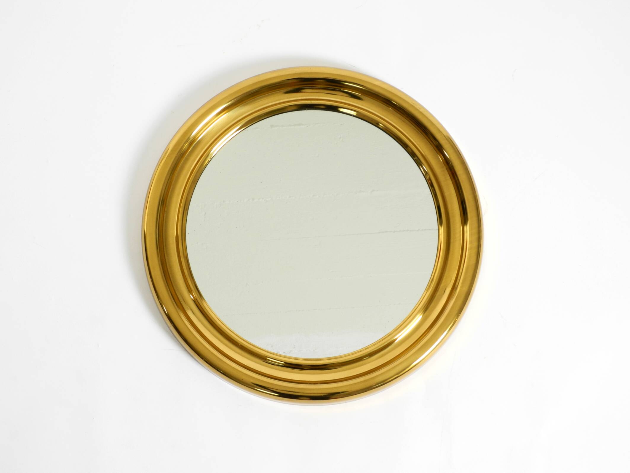 Beautiful, heavy, round Italian brass mirror from the 1960s
