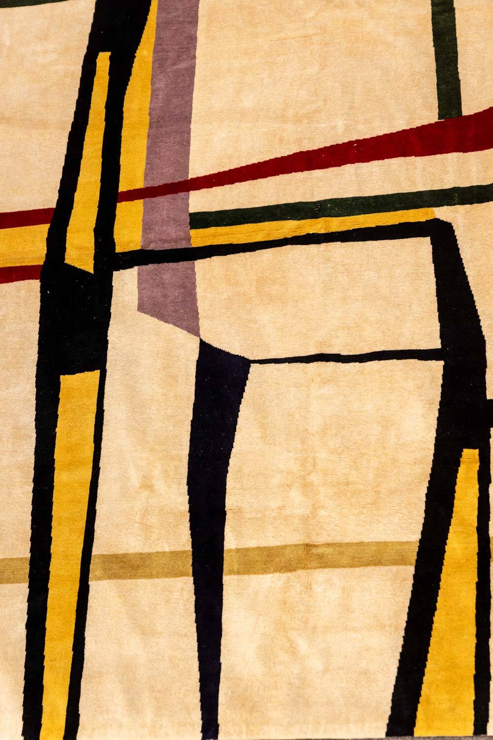 Handwoven wool tapestry with colourful geometric design. 2026.