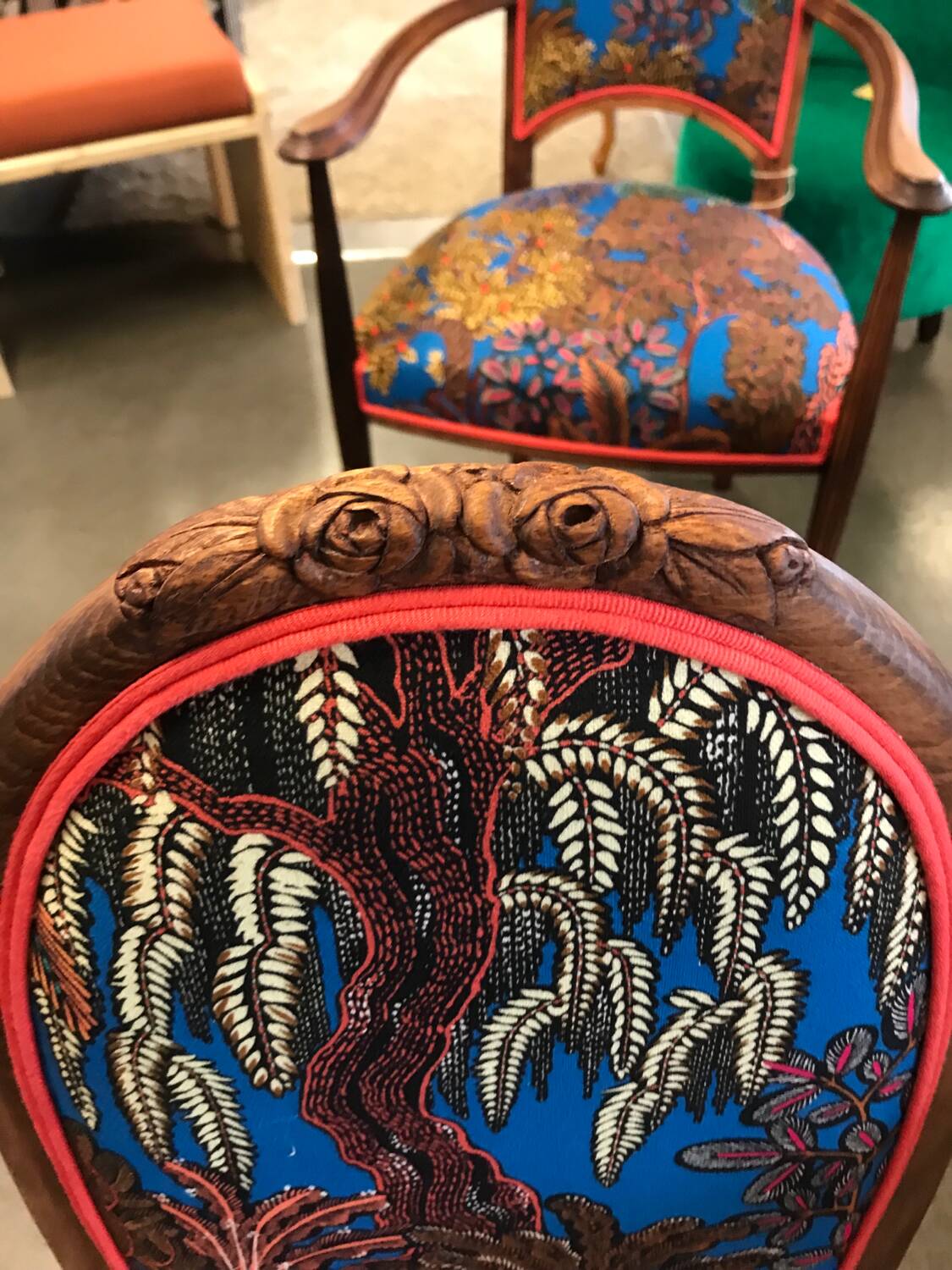 Art Nouveau chair with floral fabric and carved wood