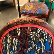 Art Nouveau chair with floral fabric and carved wood