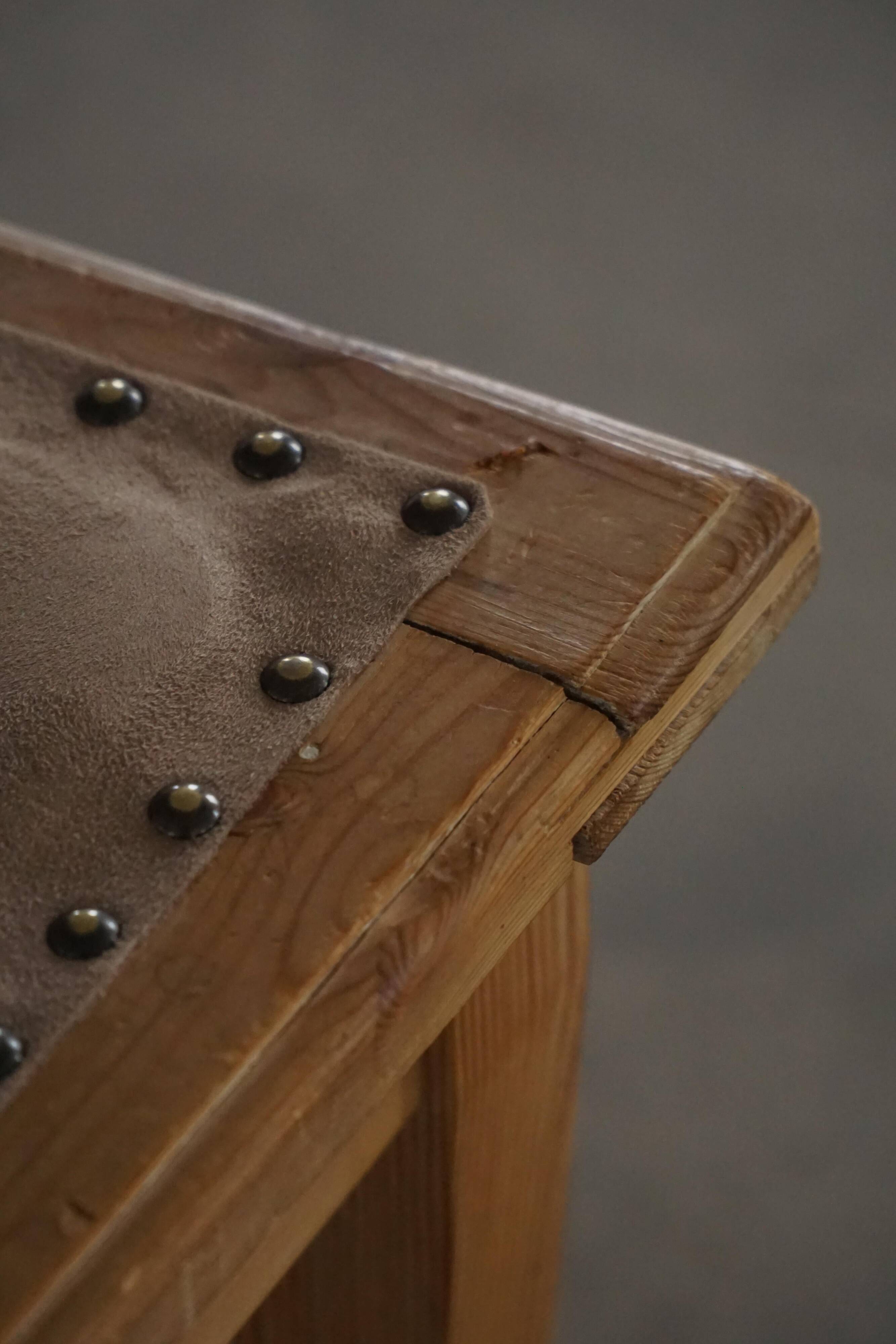 A pair of antique Danish pine stools from the late 19th century.