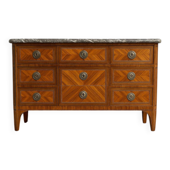 Louis XVI period commode in precious wood marquetry.