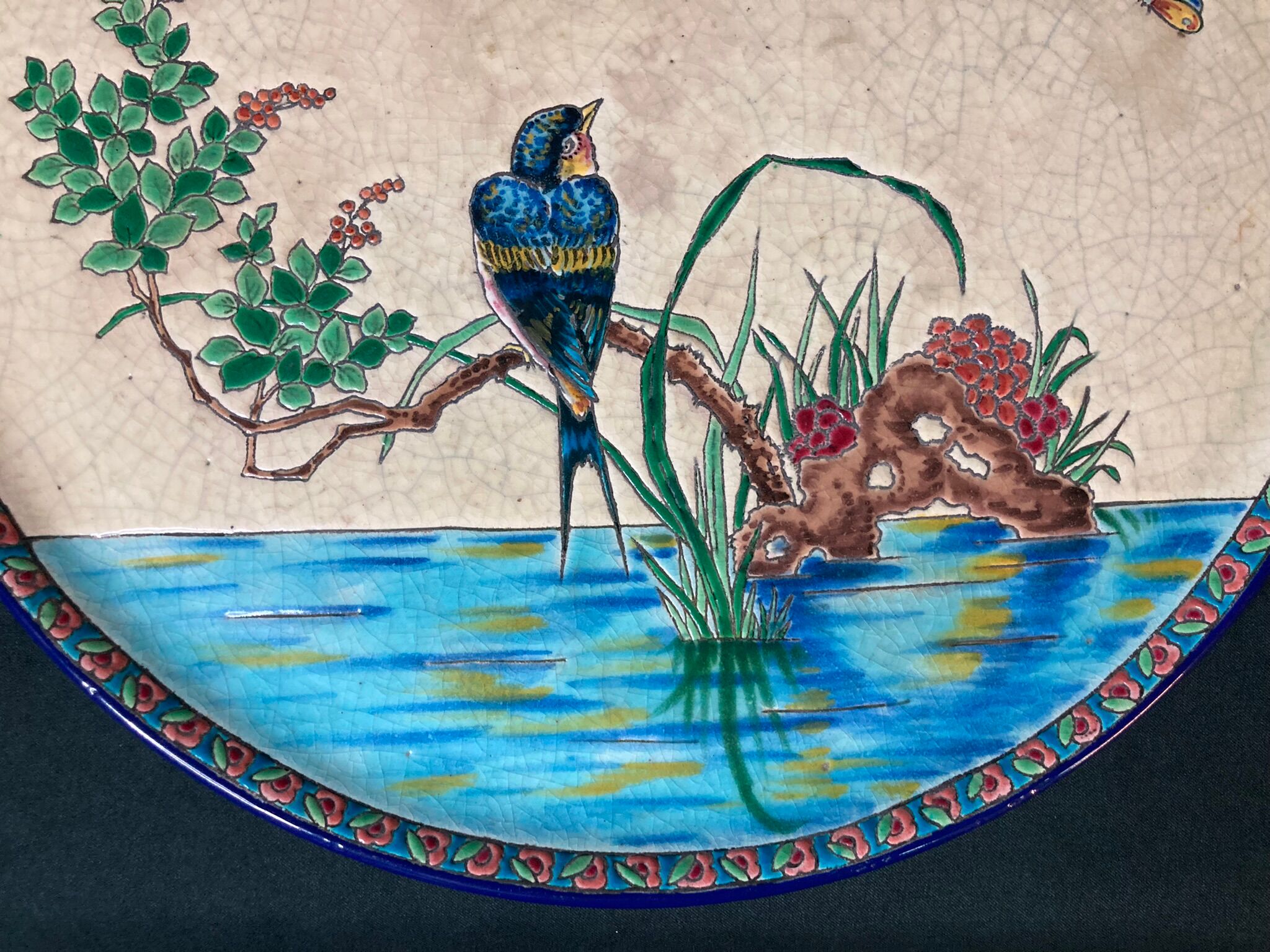 Round polychrome enamel dish with bird decoration circa 1900