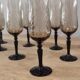 8 vintage smoked champagne flutes with black feet Arcoroc