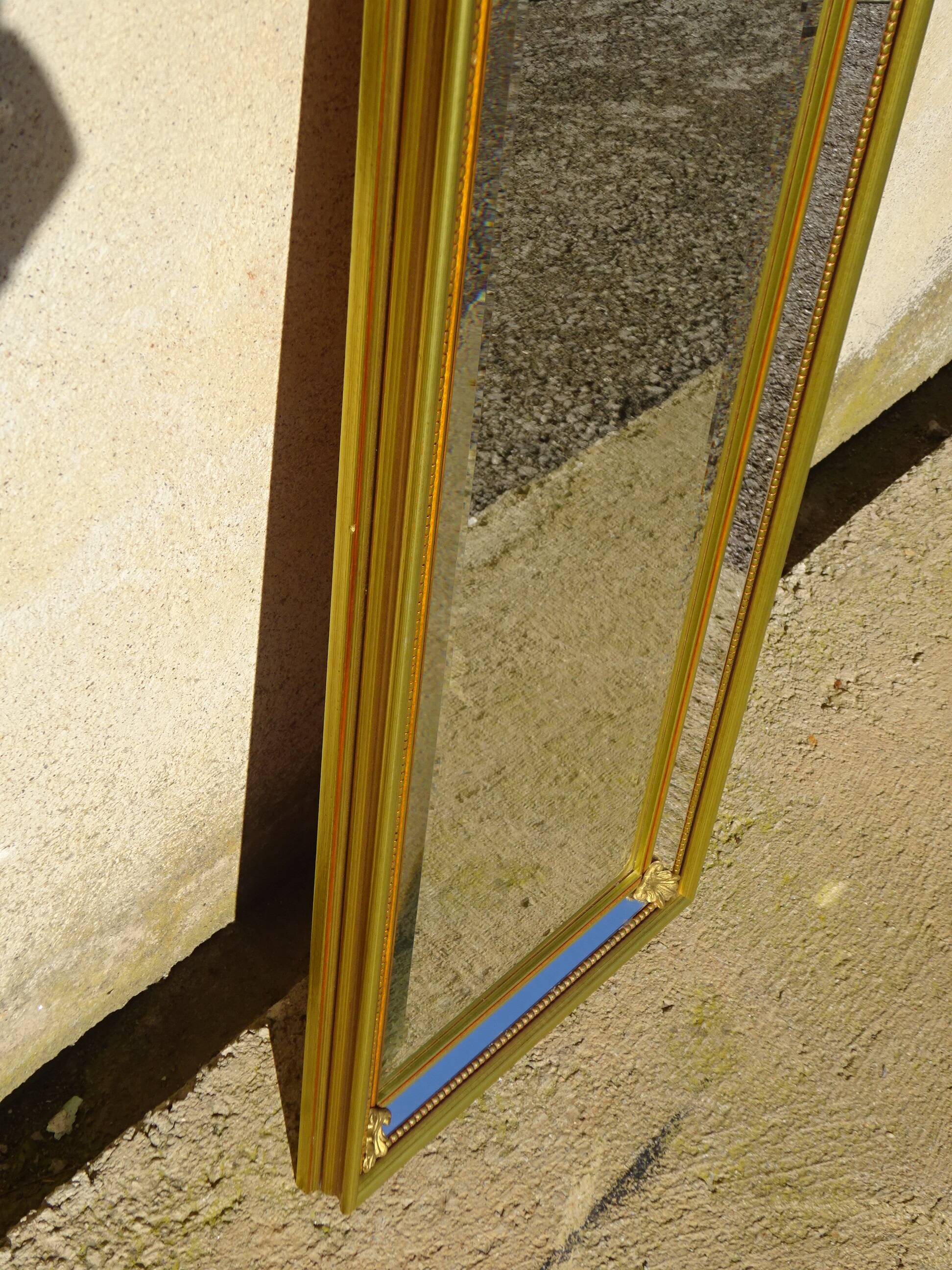 Vertical mirror, gold frame with beading.