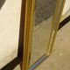 Vertical mirror, gold frame with beading.