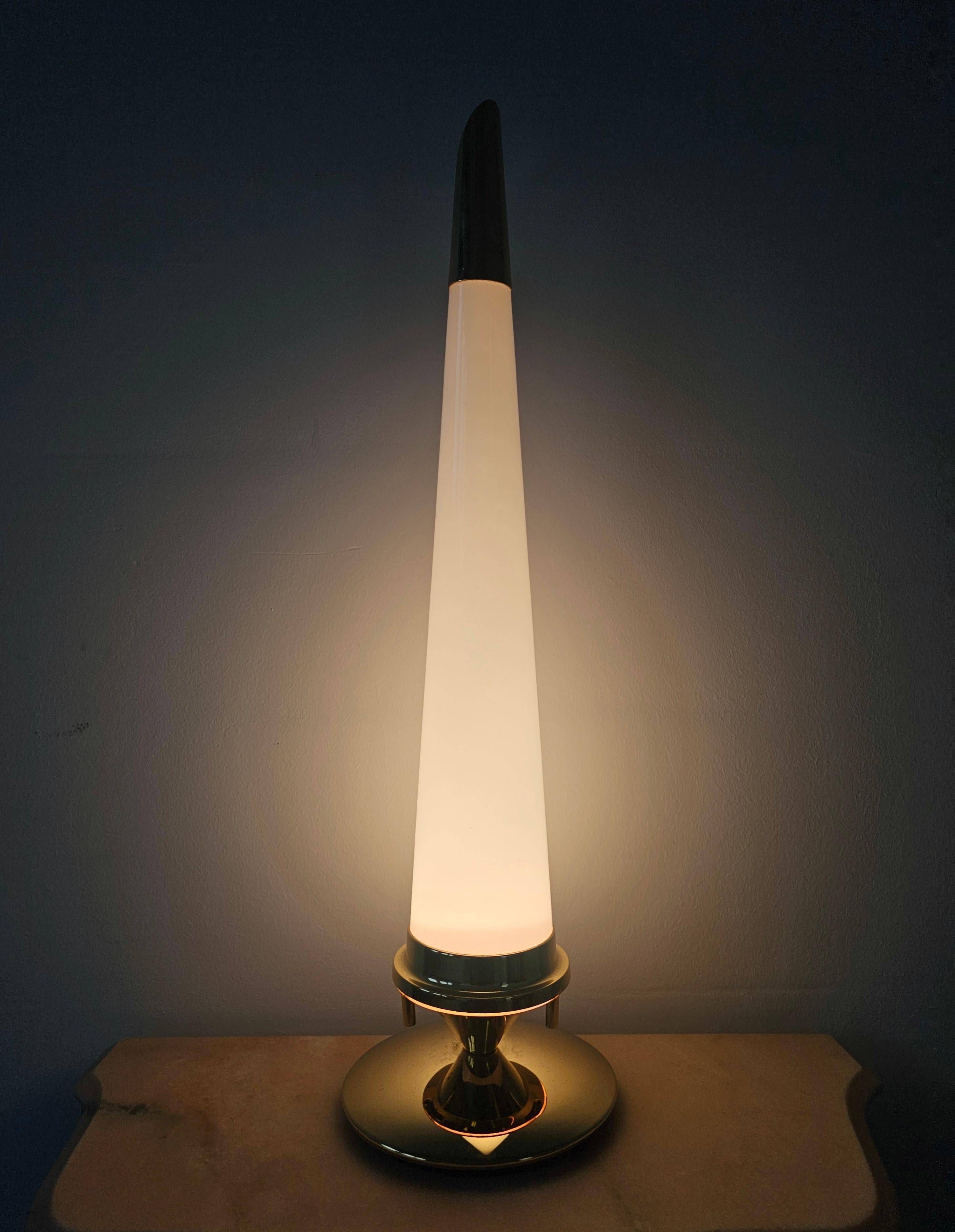 Pair of Hollywood Regency table lamps in brass with glass shades.