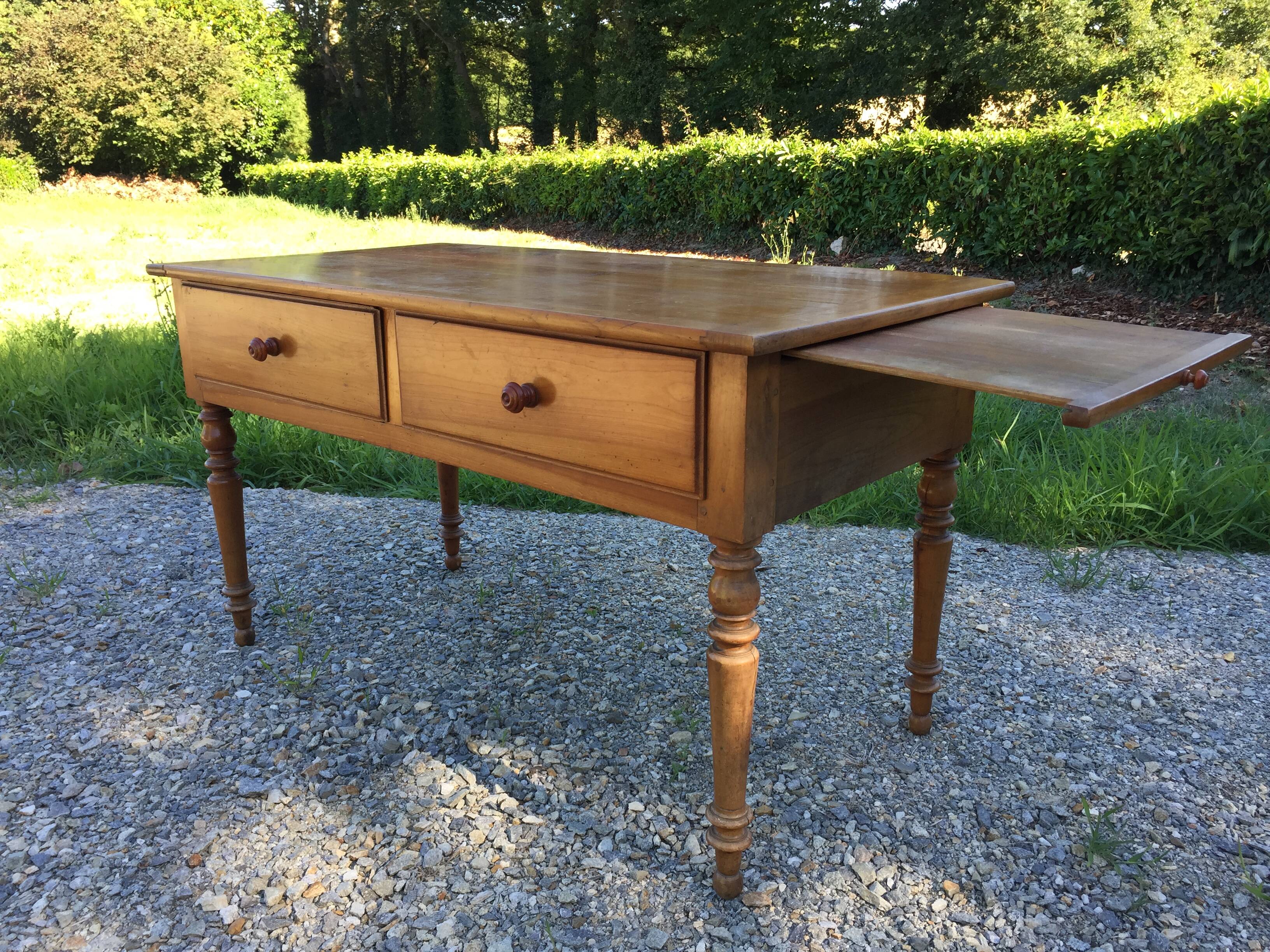 Old farmhouse table louis Philippe style in solid cherry with turned feet.