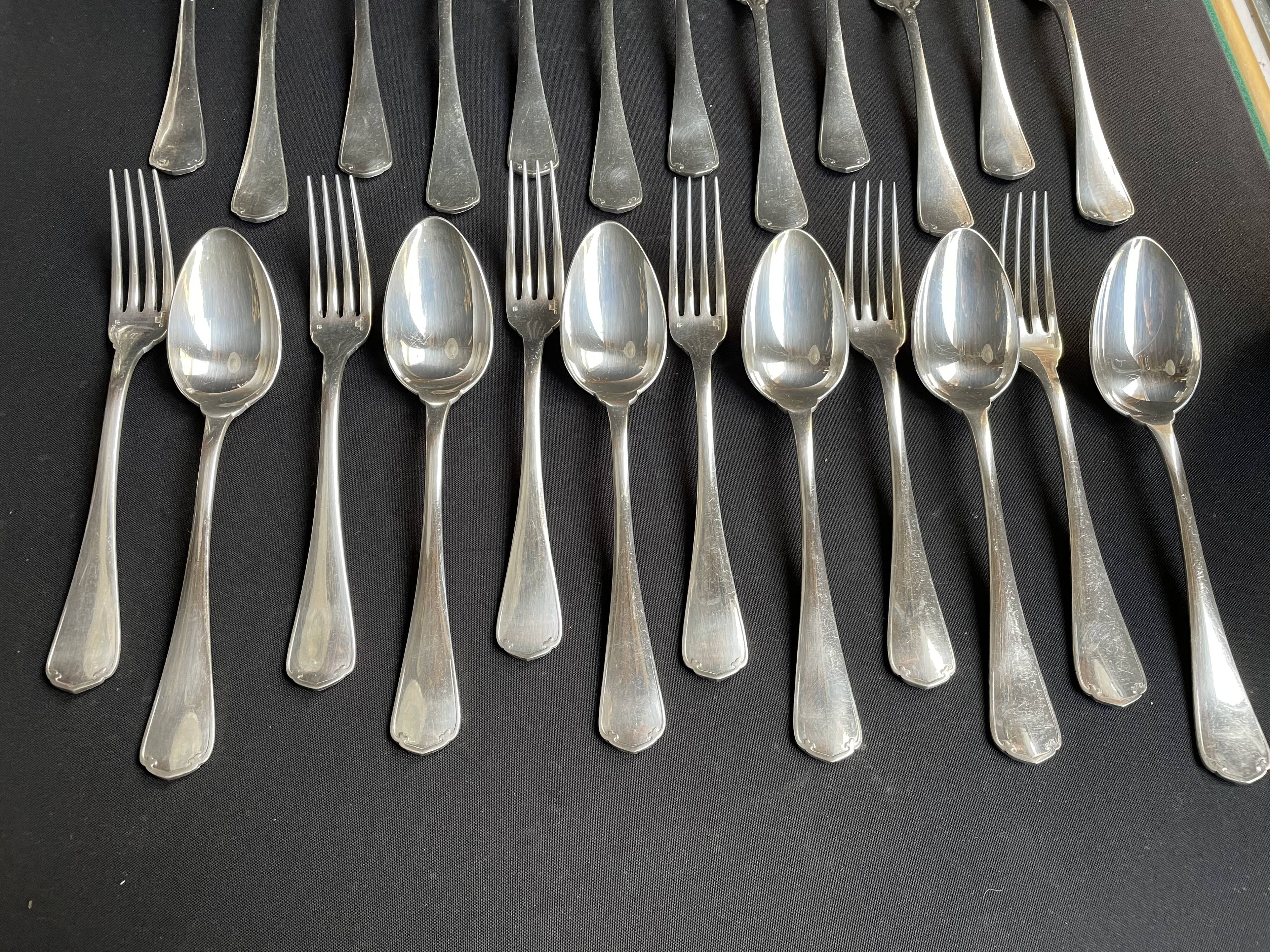 12 Christofle table forks and 12 spoons
