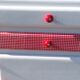 White mado buffet, red handles and tray, hen grill