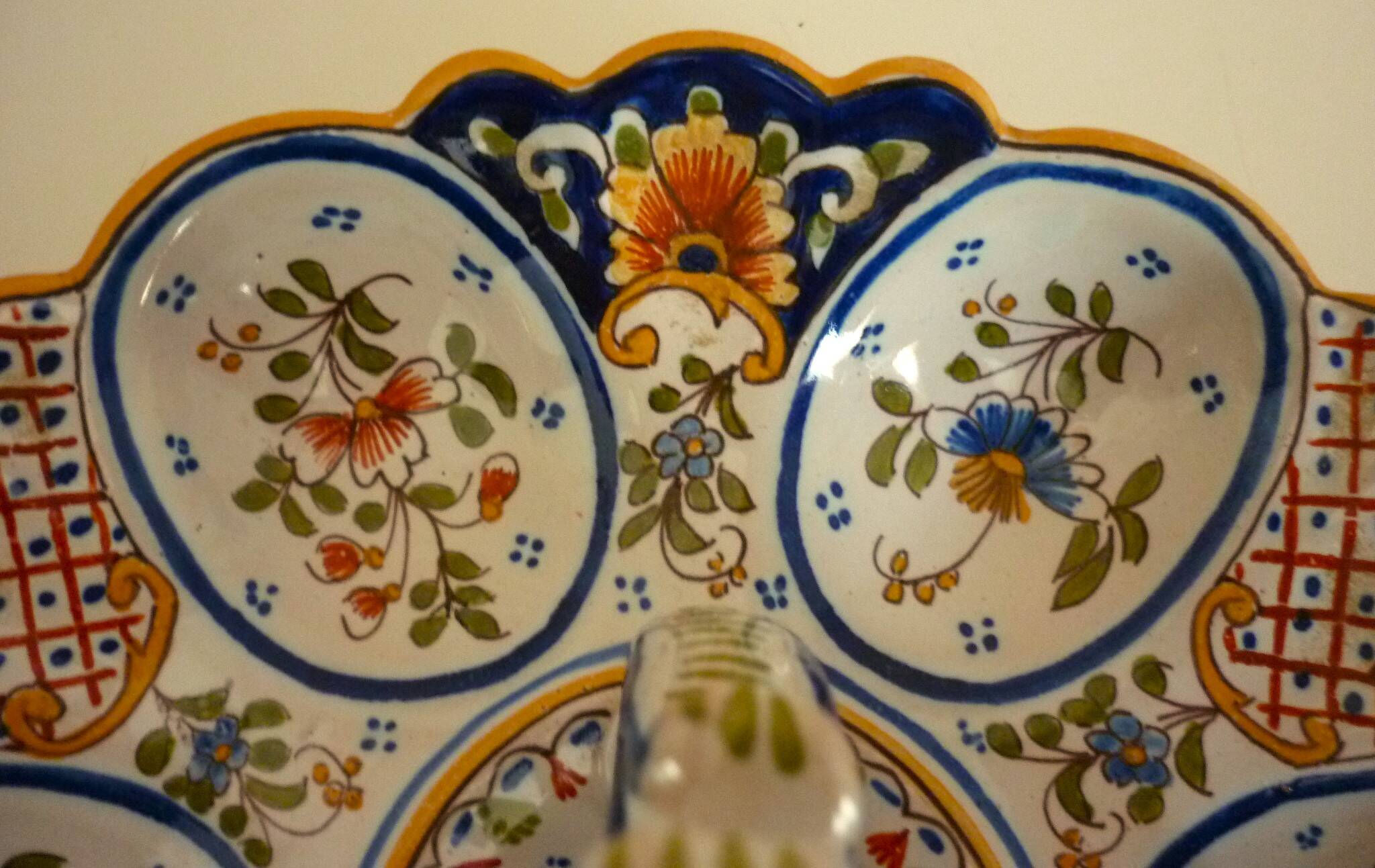 Dish, egg server in hand-painted earthenware, signed Geo Martel