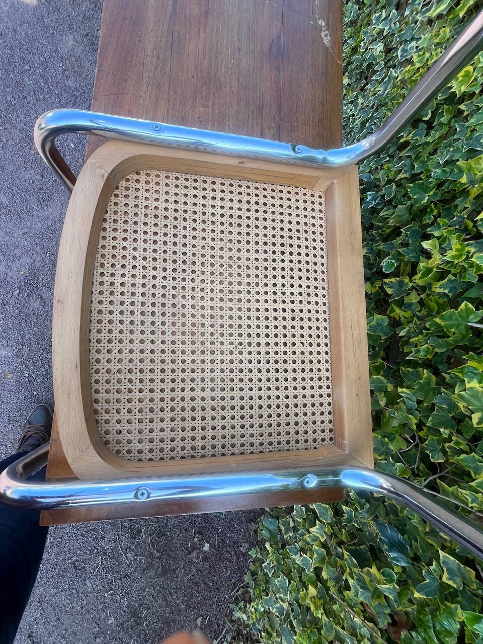 Wooden chair with caning in the style of Marcel Breuer.