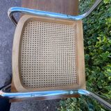 Wooden chair with caning in the style of Marcel Breuer.